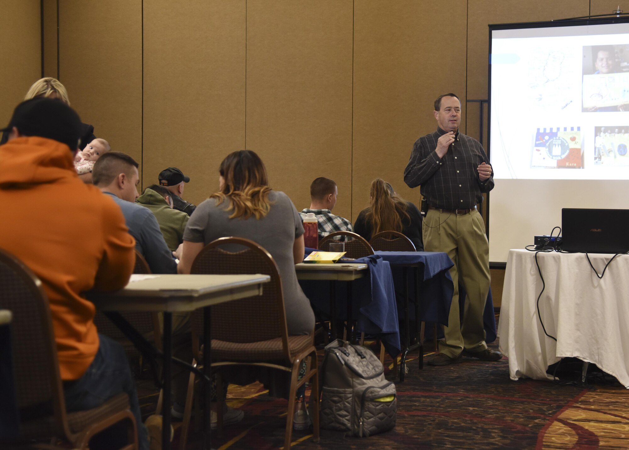 Mark Sfranski, Retiree, volunteer resiliency trainer, conducts a resiliency training too combining art and history called Battle Flag at the Ramkota Hotel in Sioux Falls, S.D., Feb 4, 2017. More than 120 members from the 114th Fighter Wing attended Yellow Ribbon Reintegration Program events which promote the well-being of National Guard and Reserve members, their families and communities by connecting them with local resources during the deployment cycle.(U.S. Air National Guard photo by Staff Sgt. Duane Duimstra/Released)