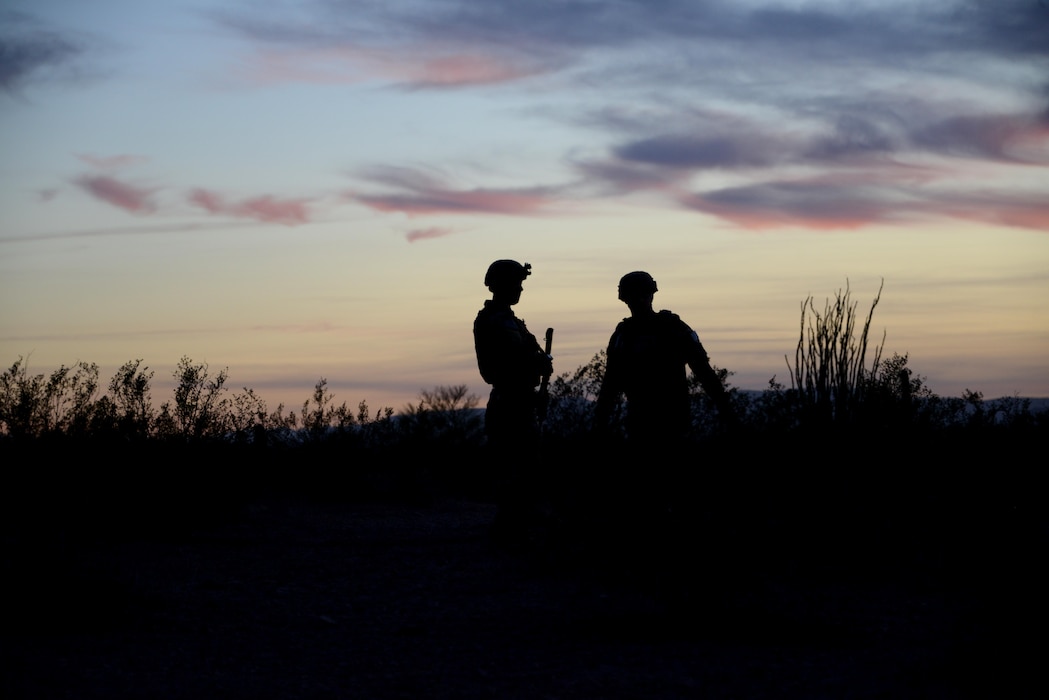 56th Civil Engineer Squadron explosive ordnance disposal Airmen search the area for possible roadside bomb threats during a contingency problem as part of Operation Enduring Training III Feb. 8, 2017, at the Barry M. Goldwater Range in Gila Bend, Az. During the training exercise, EOD Airmen work in teams to detect, defuse, and destroy potential roadside bomb threats in the surrounding area. (U.S. Air Force photo by Airman 1st Class Alexander Cook)  