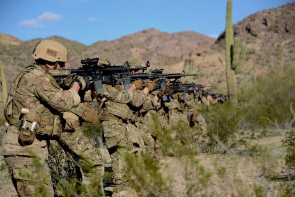 56th Civil Engineer Squadron explosive ordnance disposal Airmen fire their weapons down range during a live-fire shooting exercise Feb. 7, 2017, at the Barry M. Goldwater Range in Gila Bend, Az. During live-fire training, EOD Airmen work on accuracy by aiming down their targets. (U.S. Air Force photo by Airman 1st Class Alexander Cook)