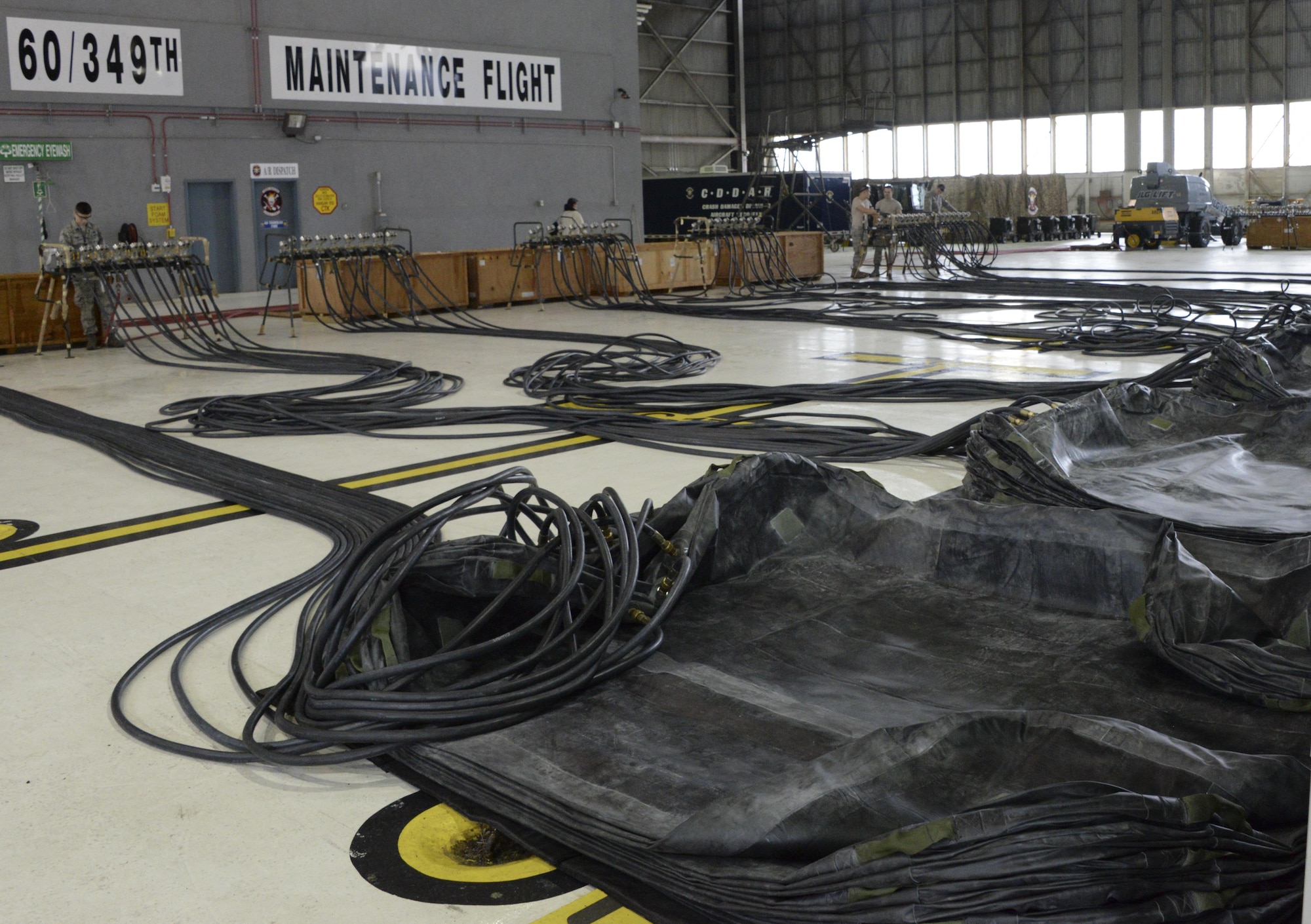 The 60th Maintenance Squadron sets up for the annual quality assurance inspection of the crash, damaged or disabled aircraft recovery program Feb. 9, 2017 at Travis Air Force Base, Calif. The lifting bags, capable of supporting up to 52,000 pounds individually, are used to lift a downed aircraft so it can be salvaged, repaired and recovered.  (U.S. Air Force photo by Senior Airman Amber Carter)