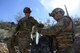 Staff Sgt. Timothy Doland, 56th Civil Engineer Squadron explosive ordnance disposal team lead, and Airman 1st Class Tahir Finley, 56th CES EOD team member, collect evidence during a contingency problem Feb. 8, 2017, at the Barry M. Goldwater Range in Gila Bend, Az. EOD Airmen collect evidence for intelligence purposes. (U.S. Air Force photo by Airman 1st Class Alexander Cook)