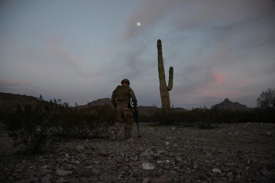 Staff Sgt. Timothy Doland, 56th Civil Engineer Squadron explosive ordnance disposal team leader, sweeps the area for possible roadside bombs during a contingency problem Feb. 8, 2017, at the Barry M. Goldwater Range in Gila Bend, Az. EOD Airmen use their equipment, along with their senses, to locate possible threats in the surrounding area. (U.S. Air Force photo by Airman 1st Class Alexander Cook)