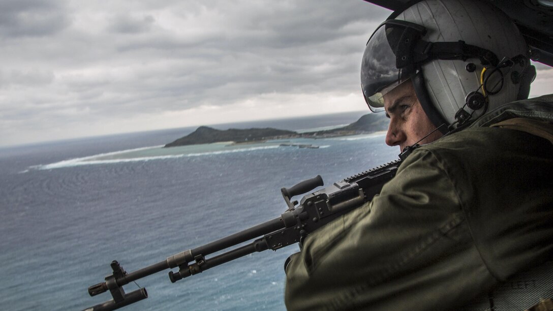 Marine Corps Lance Cpl. Derek Edwards participates in tactical air control off the coast of Okinawa, Japan, Feb. 9, 2017. The training focused on enhancing efficiency between air and ground elements, which is crucial to maintain a stronger, more capable forward-deployed force of readiness to support the U.S.-Japan alliance and U.S. regional partners. Edwards is a crew chief assigned to Marine Light Attack Helicopter Squadron 267, 3rd Marine Aircraft Wing. Marine Corps photo by Lance Cpl. Brooke Deiters