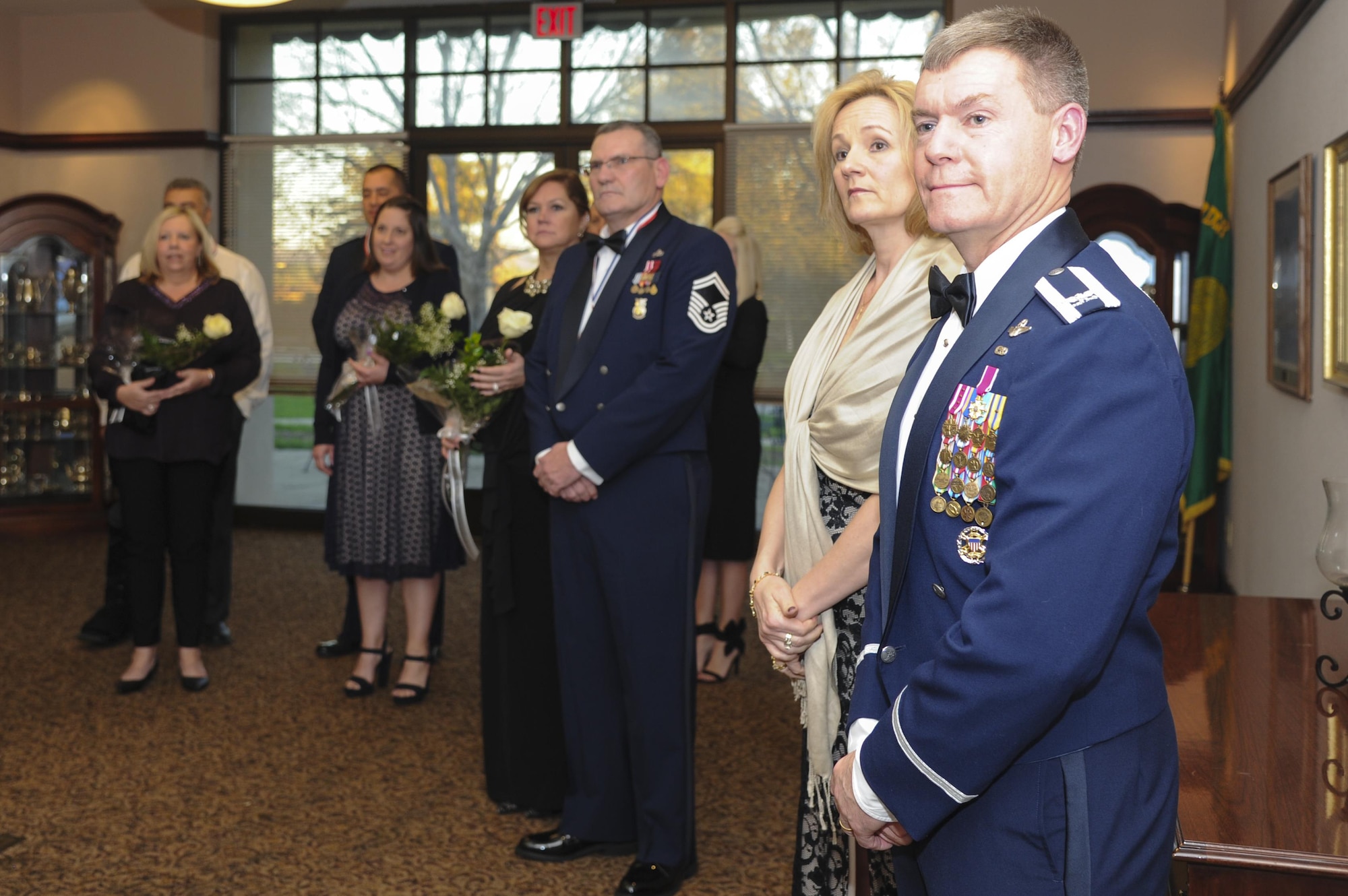 Col. Craig C. Peters, 940th Air Refueling Wing commander, his wife, Cathy, the Outstanding Airmen of the Year nominees and their guests listen to a speech during the 940 ARW Outstanding Airmen of the Year medallion ceremony Feb. 11, 2017, at Beale Air Force Base, California. Later that evening, five Airmen were named Outstanding Airman of the Year. (U.S. Air Force by Senior Airman Tara R. Abrahams)