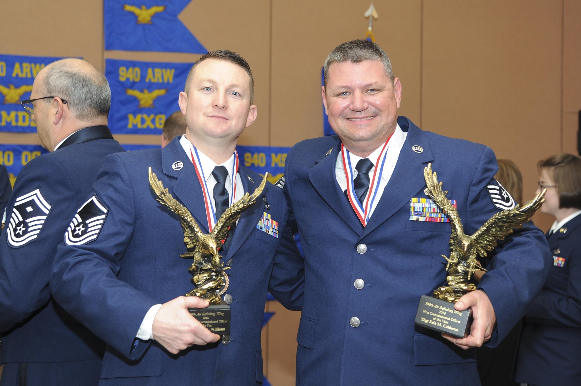 Master Sgt. Travis Williams, 940th Maintenance Squadron inspection dock chief, and Tech. Sgt. Erik Calderon, 940th Aircraft Maintenance Squadron dedicated crew chief, pose for a photo with their awards Feb. 11, 2017 at Beale Air Force Base, California. Williams and Calderon were named Senior NCO and NCO of the Year at the wing’s Outstanding Airmen of the Year banquet. (U.S. Air Force by Senior Airman Tara R. Abrahams)