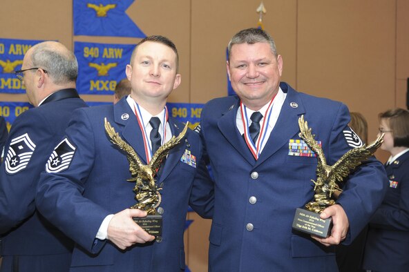 Master Sgt. Travis Williams, 940th Maintenance Squadron inspection dock chief, and Tech. Sgt. Erik Calderon, 940th Aircraft Maintenance Squadron dedicated crew chief, pose for a photo with their awards Feb. 11, 2017 at Beale Air Force Base, California. Williams and Calderon were named Senior NCO and NCO of the Year at the wing’s Outstanding Airmen of the Year banquet. (U.S. Air Force by Senior Airman Tara R. Abrahams)
