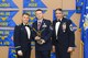Master Sgt. Travis Williams, 940th Maintenance Squadron inspection dock chief, accepts the Senior NCO of the Year award, presented by Col. Craig C. Peters, 940th Air Refueling Wing commander, and Chief Master Sgt. Carmen Madia, 940 ARW command chief Feb. 11, 2017 at Beale Air Force Base, California. Wing members and guests gathered to honor the hard work of the nominees and winners at the Outstanding Airmen of the Year banquet. (U.S. Air Force by Senior Airman Tara R. Abrahams)
