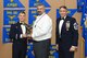 Joe Marturano, 940th Logistics Readiness Squadron transportation specialist, accepts the Civilian of the Year award, presented by Col. Craig C. Peters, 940th Air Refueling Wing commander, and Chief Master Sgt. Carmen Madia, 940 ARW command chief. Five Airmen from around the wing were named Outstanding Airmen of the Year at the OAY banquet. (U.S. Air Force by Senior Airman Tara R. Abrahams)
