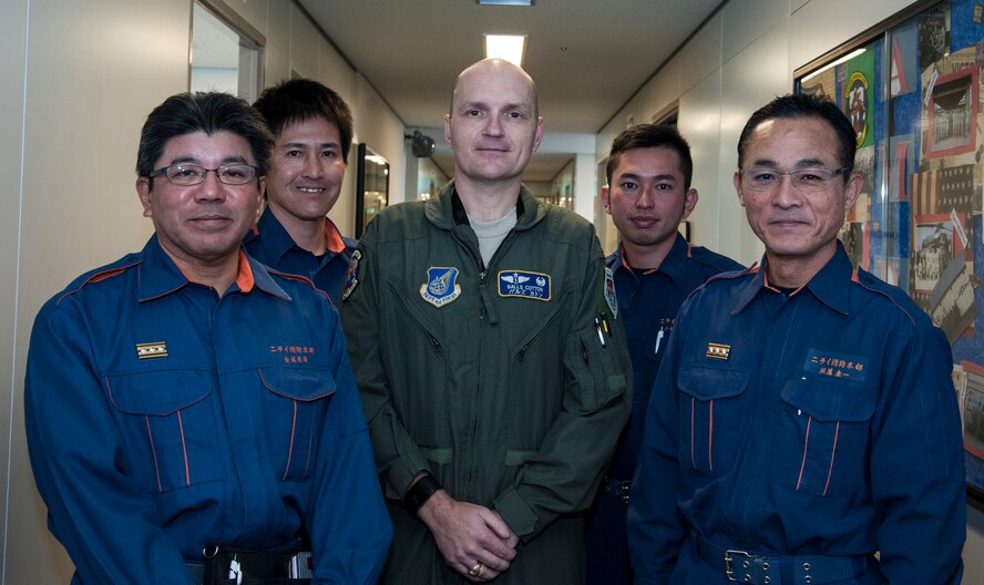 U.S. Air Force Col. John Cotton, 18th Aerospace Medicine Squadron commander, and Nirai Fire Department members saved a local woman’s life Feb. 3, 2017, near Kadena Air Base, Japan. Partnerships with the local community are vital to strengthening cooperation, especially when life-threatening incidents occur. (U.S. Air Force photo by Senior Airman Lynette M. Rolen/Released)