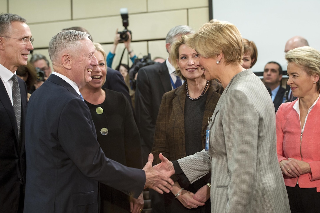 Defense Secretary Jim Mattis exchanges greetings with Italian Defense Minister Roberta Pinotti before a North Atlantic Council meeting at NATO headquarters in Brussels, Feb. 15, 2017. DoD photo by Air Force Tech. Sgt. Brigitte N. Brantley