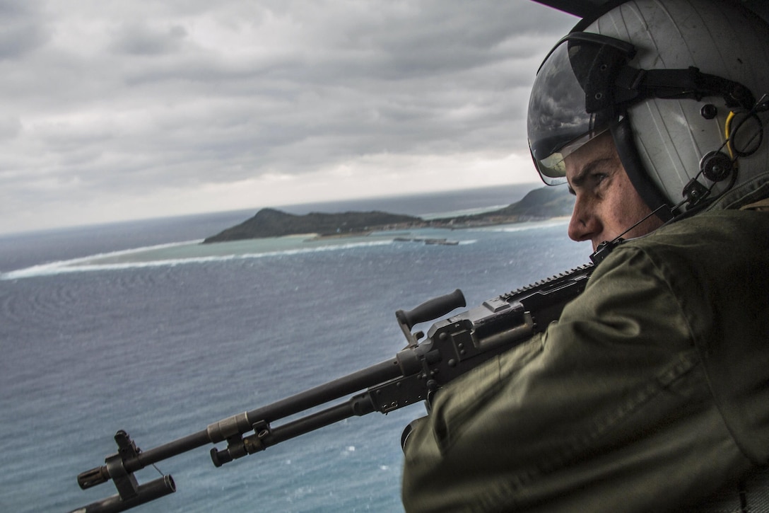 Marine Corps Lance Cpl. Derek Edwards participates in tactical air control off the coast of Okinawa, Japan, Feb. 9, 2017. The training focused on enhancing efficiency between air and ground elements, which is crucial to maintain a stronger, more capable forward-deployed force of readiness to support the U.S.-Japan alliance and U.S. regional partners. Edwards is a crew chief assigned to Marine Light Attack Helicopter Squadron 267, 3rd Marine Aircraft Wing. Marine Corps photo by Lance Cpl. Brooke Deiters