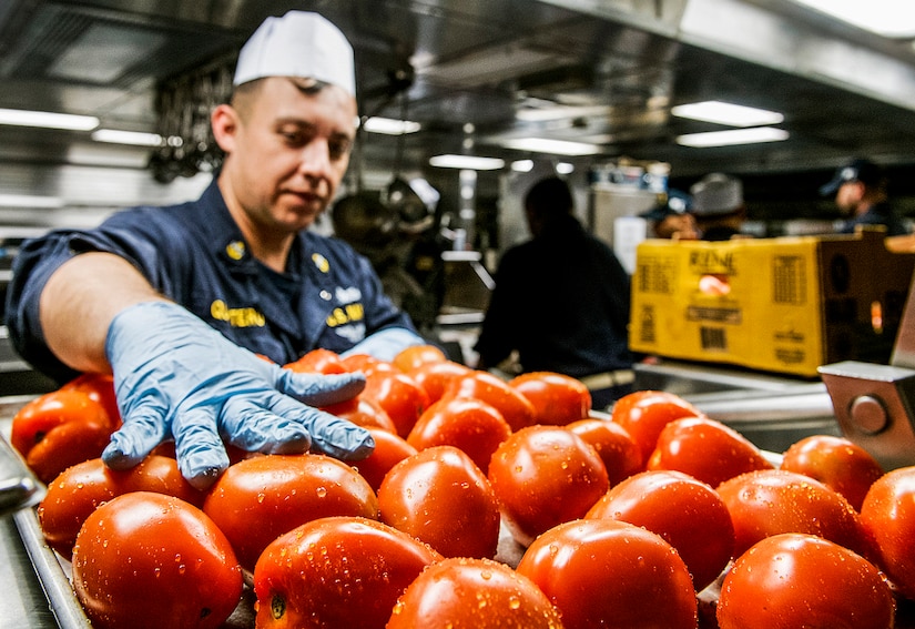 A sailor prepares food in the mess deck of the USS Lake Champlain in the Pacific Ocean, Feb. 5, 2017. The ship is part of the U.S. Pacific Fleet-led initiative to extend the command and control functions of the U.S. 3rd Fleet in the Indo-Asia-Pacific region. Navy photo by Petty Officer 2nd Class Nathan K. Serpico