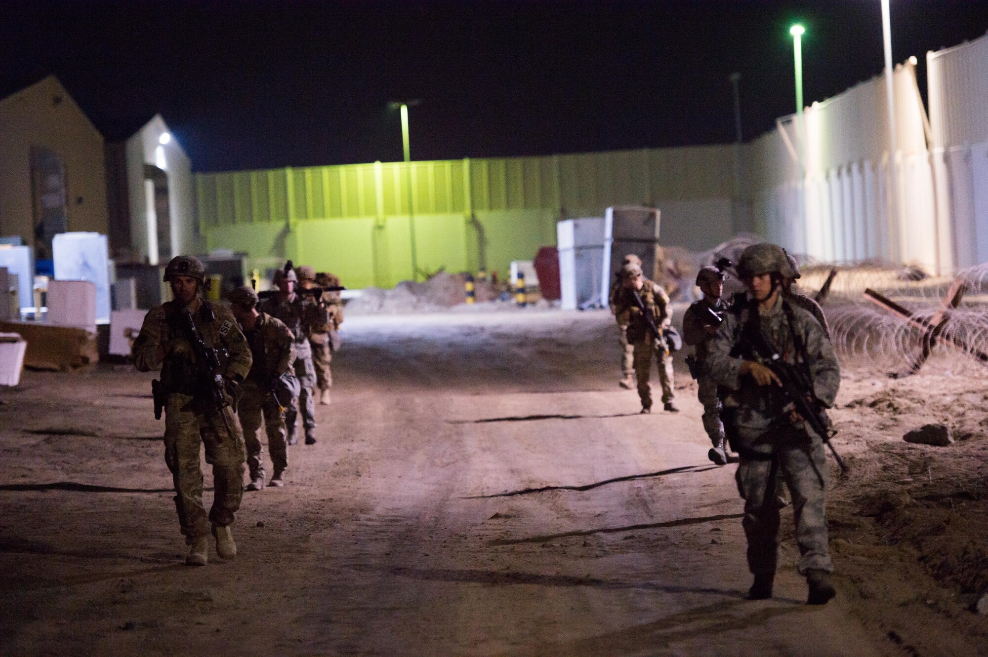 Members of the 380th Expeditionary Security Forces Squadron complete an improvised explosive device training scenario with a military working dog team at an undisclosed location in Southwest Asia, Feb. 9, 2017. During this exercise members of the 380th Explosive Ordnance Disposal collaborated with military working dog units from the 380 ESFS and Commander, Task Group 56.7. (U.S. Air Force photo/Senior Airman Tyler Woodward)