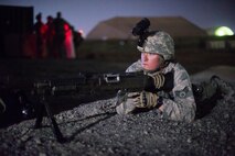 A member of the 380th Expeditionary Security Forces Squadron completes an improvised explosive device training scenario with a military working dog team at an undisclosed location in Southwest Asia, Feb. 9, 2017. During this exercise members of the 380th Explosive Ordnance Disposal collaborated with military working dog units from the 380 ESFS and Commander, Task Group 56.7. (U.S. Air Force photo/Senior Airman Tyler Woodward)