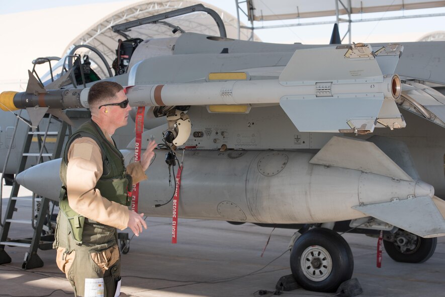 U.S. Air Force Lt. Col. Joe “Slap” Goldsworthy, an Airmen assigned to the Italian air force 132nd Groupo as part of the Military Personnel Exchange Program, inspects his AMX A-11 Ghibli before departing for a mission at an undisclosed location in Southwest Asia, Jan. 11, 2017. Goldsworthy, an A-10 Thunderbolt II pilot with more than 2,700 flight hours of experience, began his time with the Italian air force in September 2014, when he was assigned to the 132nd Groupo stationed at Istrana Air Base in Treviso, Italy, as an AMX A-11 Ghibli pilot. (U.S. Air Force photo by Master Sgt. Benjamin Wilson)