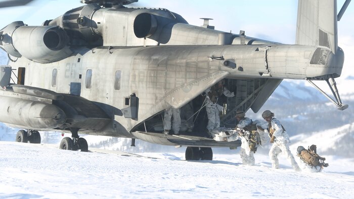 Marines with 2nd Battalion, 2nd Marine Regiment, 2nd Marine Division, begin offloading from a CH-53E Super Stallion with Marine Heavy Helicopter Squadron (HMH) 462 during the insertion drill of their Mountain Exercise training at Marine Corps Mountain Warfare Training Center, Bridgeport, California, Feb. 3. On and offload drills also help air crew and pilots refine their tactics, techniques and procedures during real-time training. 