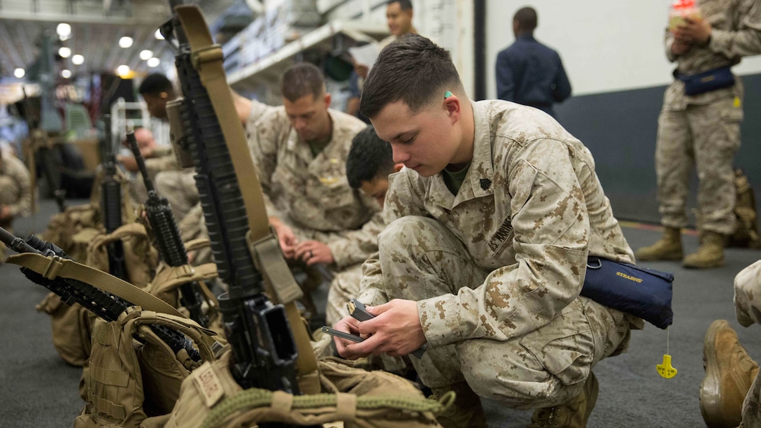 Marine Sgt. Caleb Kuhlman, a supply chain administration and operations specialist with Combat Logistic Detachment 111, Combat Logistics Battalion 11, 11th Marine Expeditionary Unit, fills an ammunition magazine for an M16A4 Service Rifle before a live-fire range or “deck shoot” aboard the USS Makin Island (LHD 8) Jan. 19. Maintaining basic rifle skills is necessity for all Marines regardless of their Military Occupation Specialty (MOS). Combat Logistics Battalion 11 is the logistics combat element of the MEU and a force multiplier for the Marine Air-Ground Task Force; not only by providing a range of logistical support to units in training and combat environments, but also in their ability to employ their weapons systems on their person or vehicles. 