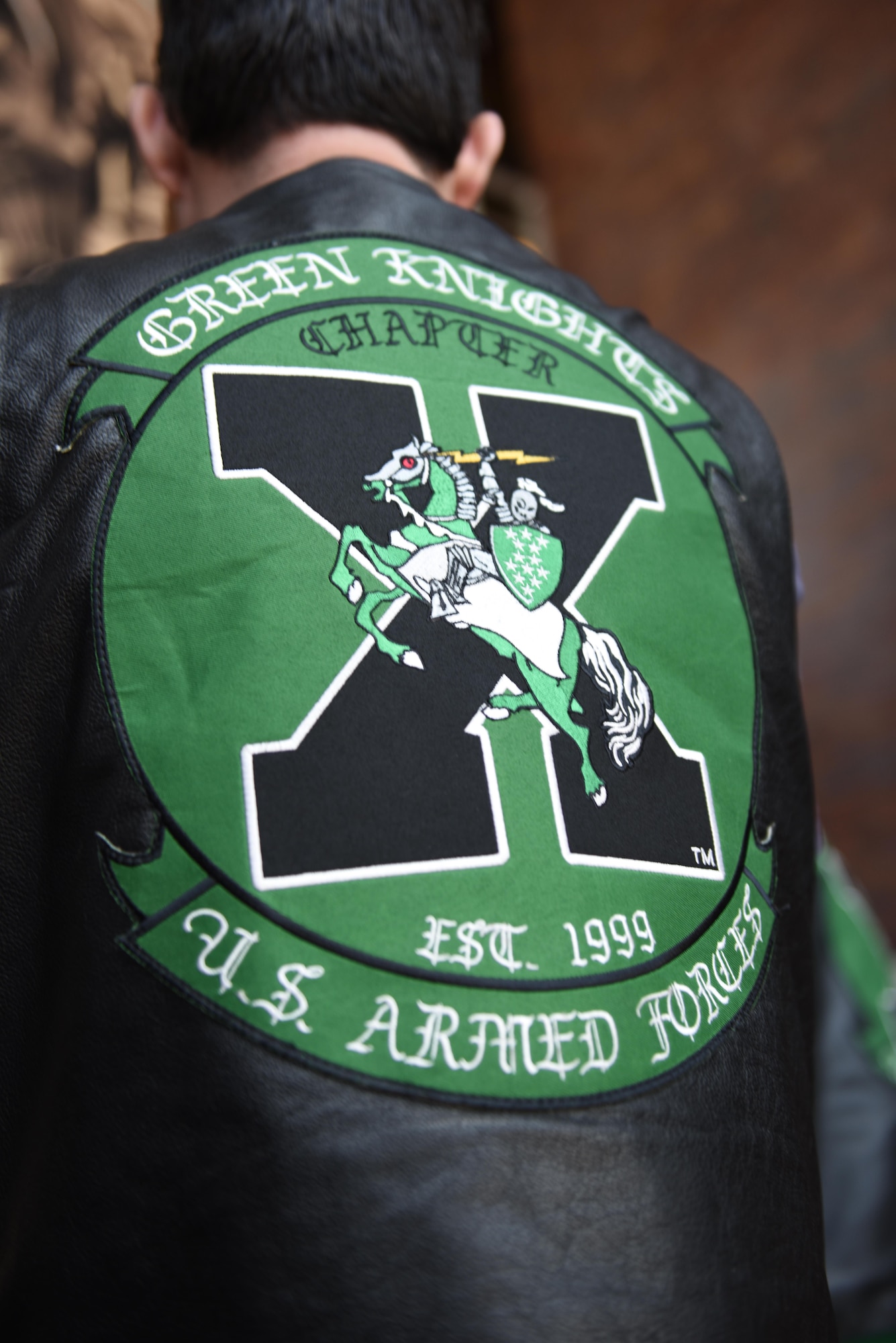 The Green Knights motorcycle club local chapter members gathered in Joint Base Charleston headquarters to present the Knights of the Round Table tournament scepter to base leadership Feb. 7, 2017. There are over 130 Green Knight chapters worldwide on military installations.