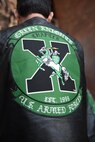The Green Knights motorcycle club local chapter members gathered in Joint Base Charleston headquarters to present the Knights of the Round Table tournament scepter to base leadership Feb. 7, 2017. There are over 130 Green Knight chapters worldwide on military installations.