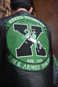 The Green Knights motorcycle club local chapter members gathered in Joint Base Charleston headquarters to present the Knights of the Round Table tournament scepter to base leadership Feb. 7, 2017. There are over 130 Green Knight chapters worldwide on military installations.