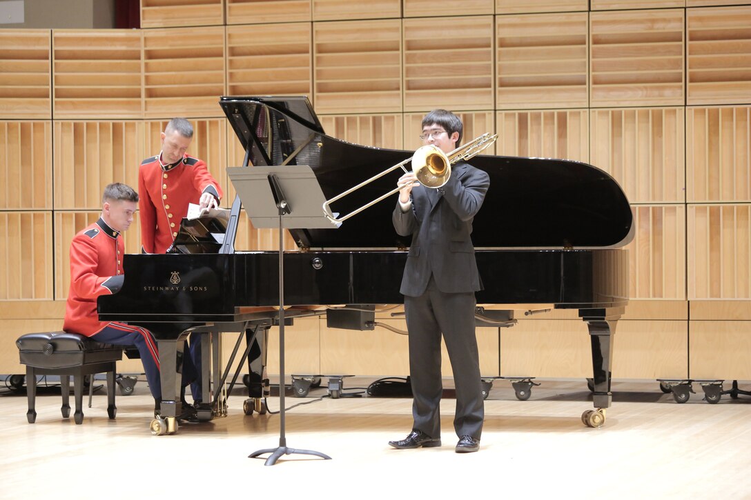 On Feb. 11, 2017, eight high school musicians competed for a $2,500 scholarship from the Marine Corps Heritage Foundation and the chance to solo with the Marine Band. French horn player Shawn Zheng won first place and trumpet player Forrest Johnston was named runner up and received a $500 scholarship from the Marine Corps Heritage Foundation. Pictured is trombone player George Foreman. (U.S. Marine Corps photo by Master Sgt. Kristin duBois/released)