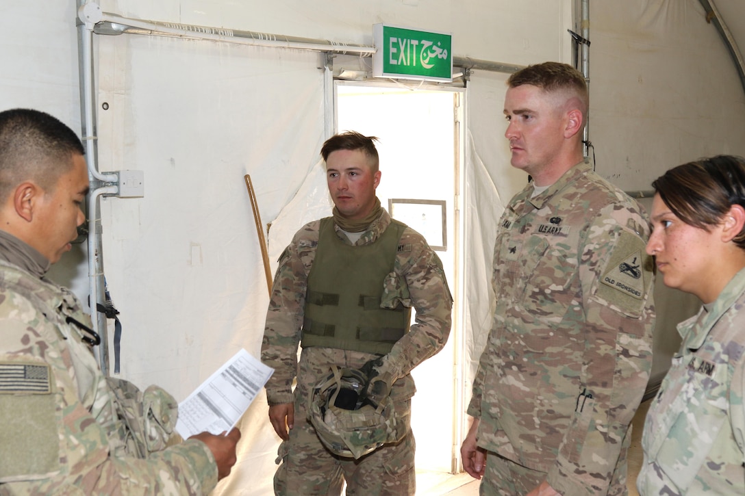 Sgt. Silver Peralta, Infantryman, (left), infantryman from San Jose, Calif., reviews shot groups with (from left to right) Spc. Joshua Frye, Sgt. Stephen Lamb and Sgt. Katrina Ellis, Soldiers with Headquarters and Headquarters, 2nd Brigade Engineer Battalion, 3rd Infantry Division after day gunnery iterations Feb. 9, 2017. FM 3-22.3 states that the three fundamental requirements for a combat ready unit are rifle marksmanship, physical fitness and precision gunnery skills.