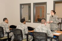 U.S. Air Force Reserve Master Sgt. Katie Widger, education and training manager, 913th Force Support Squadron, briefs a group of Airman on End of Course (EOC) and Professional Military Education (PME) testing Feb. 12, 2017, at Little Rock Air Force Base, Ark. Members test in upgrade training on their 5 or 7 Level Career Development Courses (CDCs) in order to advance to the next skill level. Successful completion of the members CDC's are mandatory for their upgrade. (U.S. Air Force photo by Master Sgt. Jeff Walston/Released)