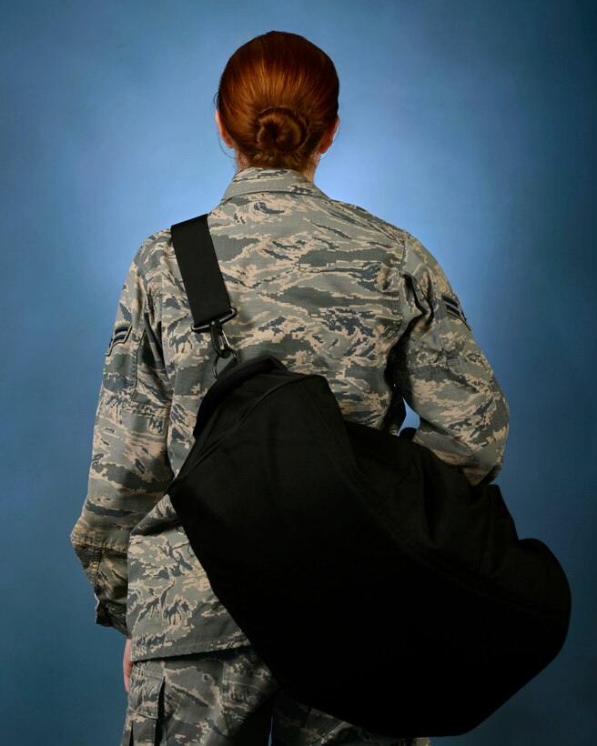 Air Force Instruction 36-2903, Dress and Personal Appearance of Air Force Personnel, was updated to include new uniform authorizations, such as the use of gym bag shoulder straps, Feb. 9, 2017. It is the responsibility of all Airmen to stay informed of instruction changes as they are constantly evolving. (U.S. Air Force illustration by Airman 1st Class Kathryn R.C. Reaves)
