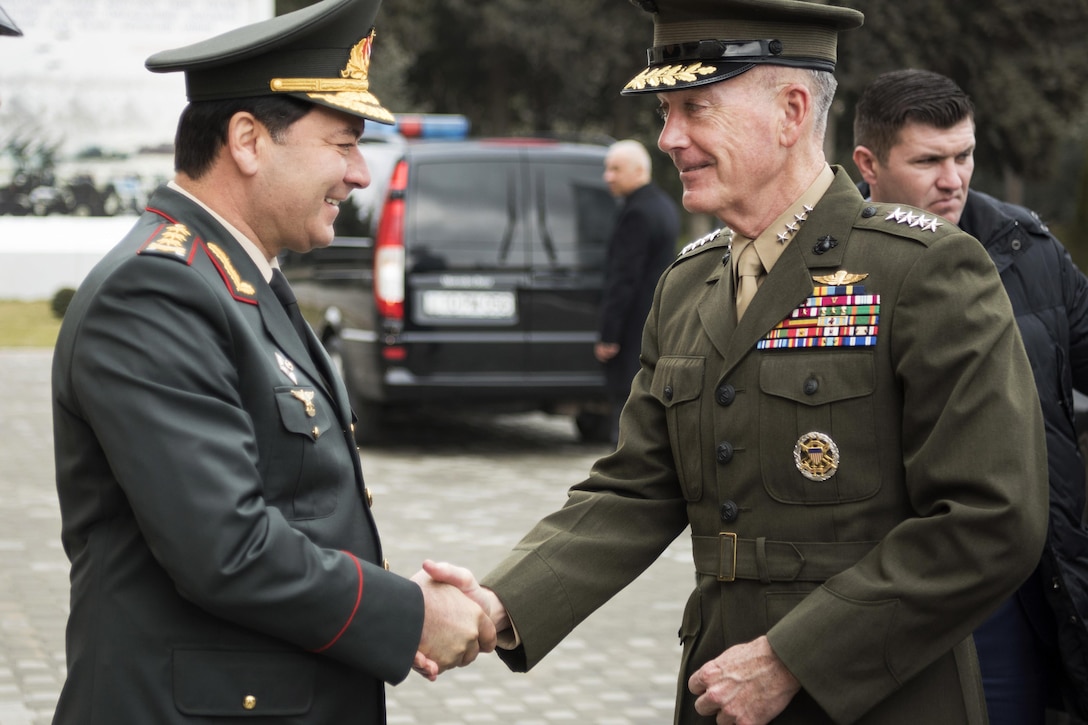 Marine Corps Gen. Joe Dunford, chairman of the Joint Chiefs of Staff, shakes hands with Azerbaijan Defense Minister Col. Gen. Zakir Hasanov in Baku, Azerbaijan, Feb. 16, 2017. DoD photo by Navy Petty Officer 2nd Class Dominique A. Pineiro