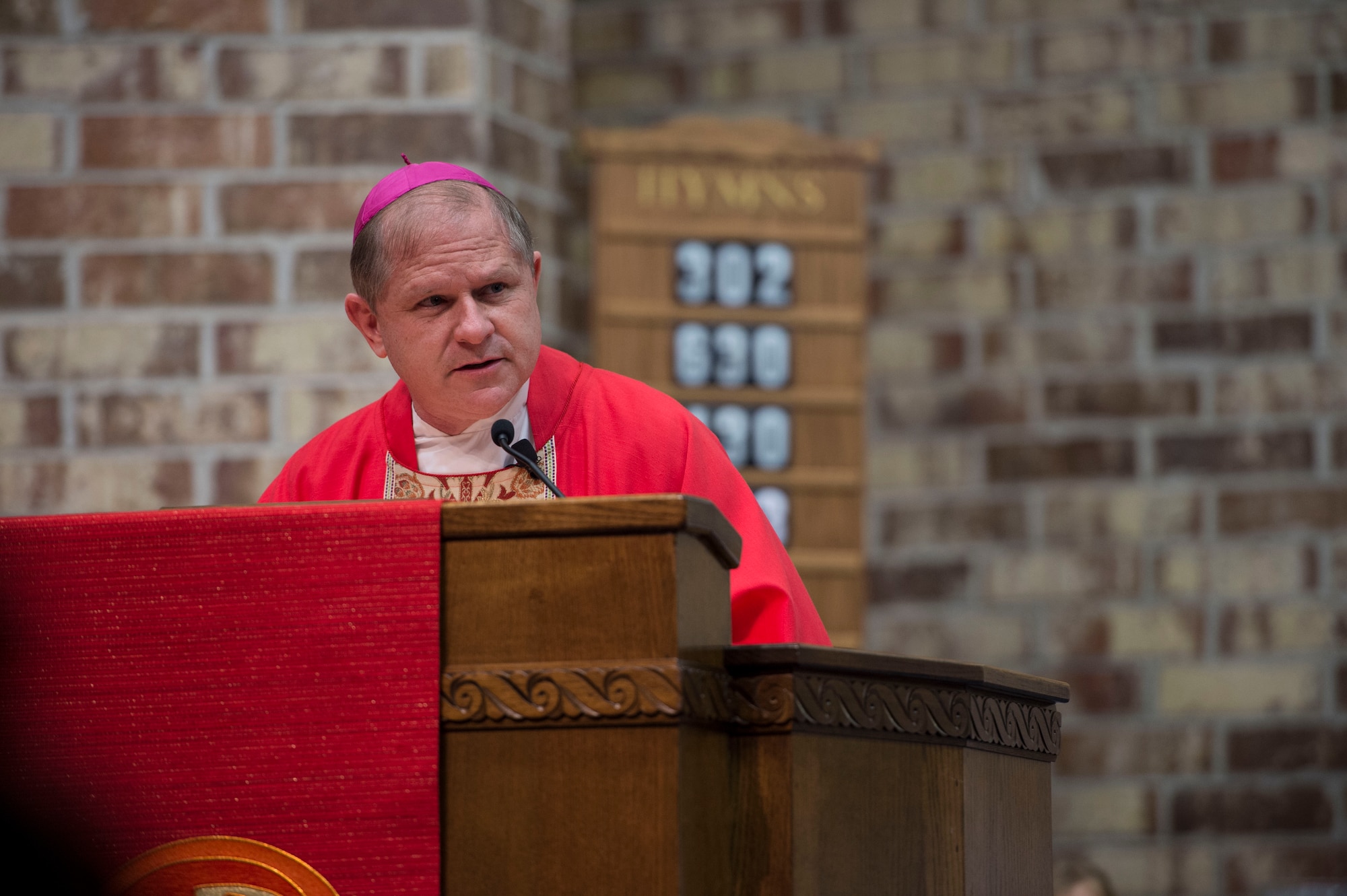 Bishop Robert Coyle, Archdiocese for the Military Service, addresses the congregation during the Confirmation Mass, Feb. 14, 2017, at Moody Air Force Base, Ga. Pope John Paul II created the Archdiocese for the Military Services in 1985 to provide the Catholic Church's full range of pastoral ministries and spiritual services to those in the United States Armed Forces. The Archbishop for the Military Services is responsible for the spiritual welfare of more than 1.8 million men, women and children. (U.S. Air Force photo by Andrea Jenkins)