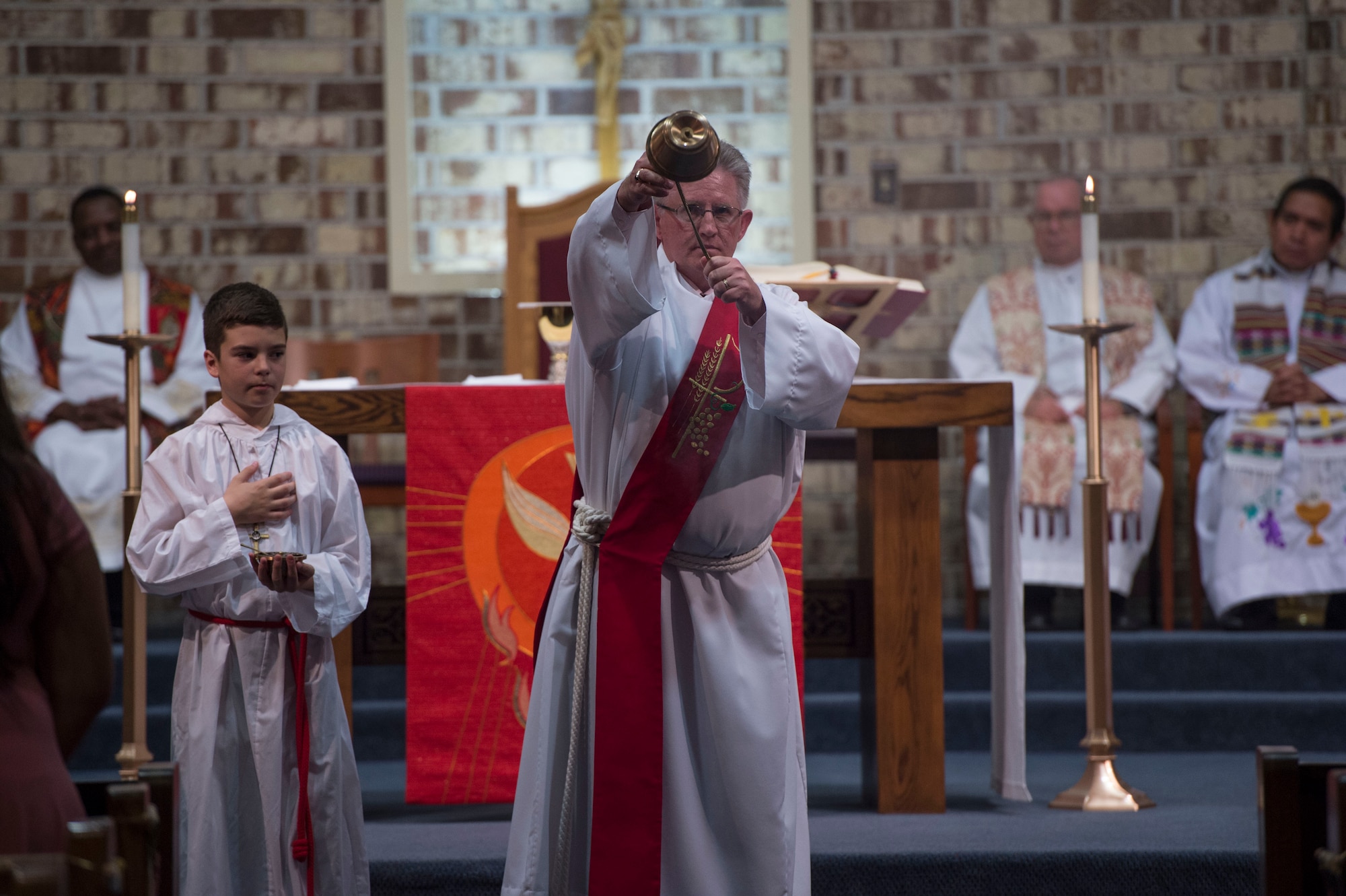 Deacon Peter Falkenhausen, 23d Wing Safety, blesses the congregation during Confirmation Mass, Feb. 14, 2017, at Moody Air Force Base, Ga. Pope John Paul II created the Archdiocese for the Military Services in 1985 to provide the Catholic Church's full range of pastoral ministries and spiritual services to those in the United States Armed Forces. The Archbishop for the Military Services is responsible for the spiritual welfare of more than 1.8 million men, women and children. (U.S. Air Force photo by Andrea Jenkins)
