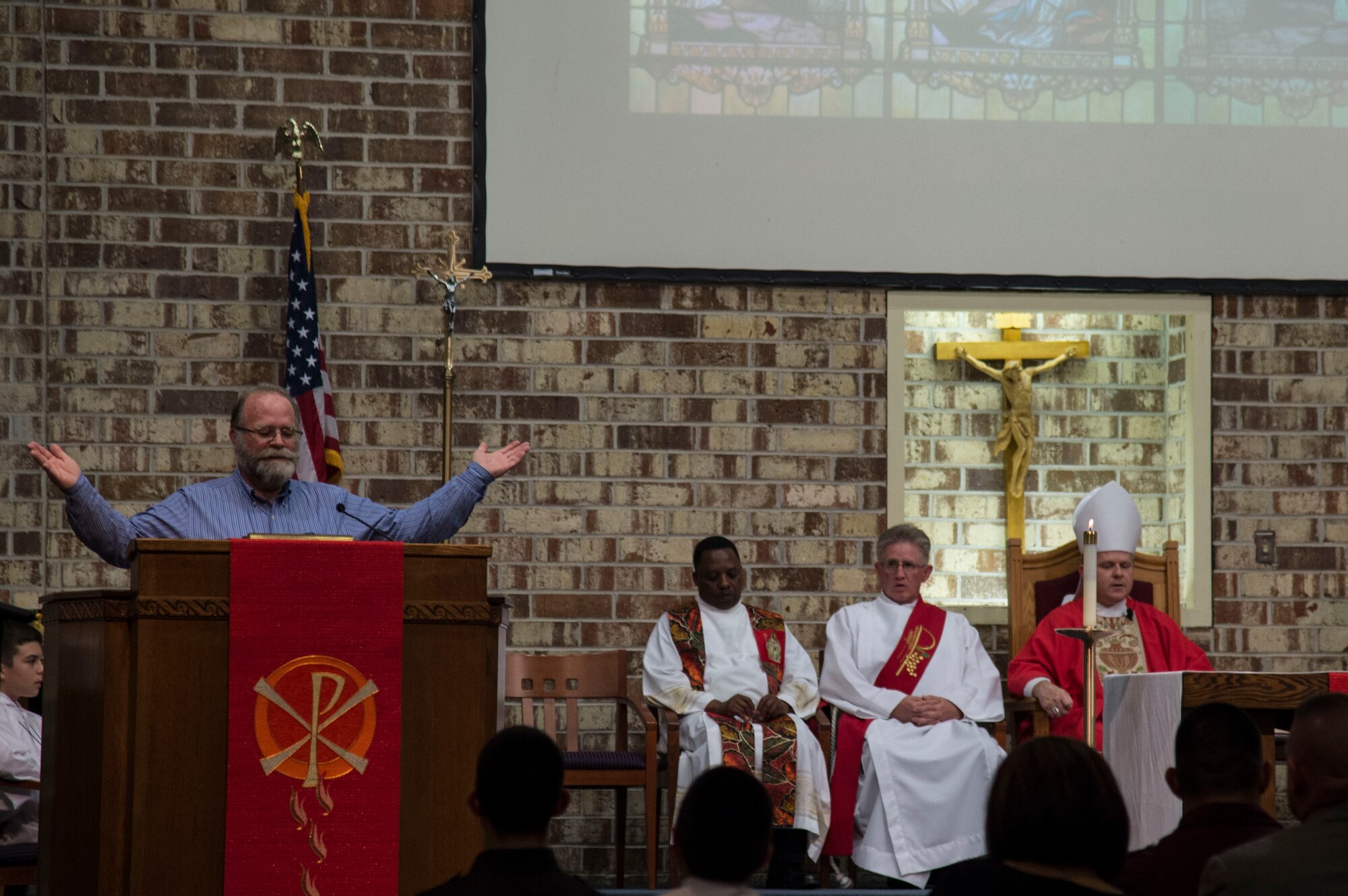 A member of the choir sings during the Confirmation Mass, Feb. 14, 2017, at Moody Air Force Base, Ga. Pope John Paul II created the Archdiocese for the Military Services in 1985 to provide the Catholic Church's full range of pastoral ministries and spiritual services to those in the United States Armed Forces. The Archbishop for the Military Services is responsible for the spiritual welfare of more than 1.8 million men, women and children. (U.S. Air Force photo by Andrea Jenkins/Released)