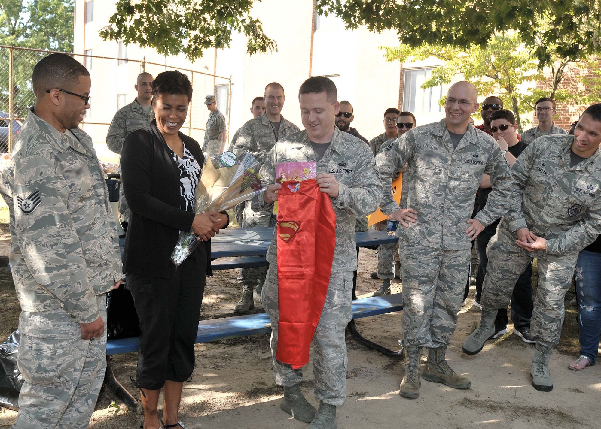 Staff Sgt. Rasheed, 7th Intelligence Squadron, is greeted by Airmen from the 7th IS during a welcome back celebration Sep. 16, 2016, at Fort George G. Meade, Maryland. Rasheed suffered a cerebral aneurysm in 2015 and is currently working to return to his career field as an intelligence analyst. (U.S. Air Force photo/Tech. Sgt. Veronica Pierce)