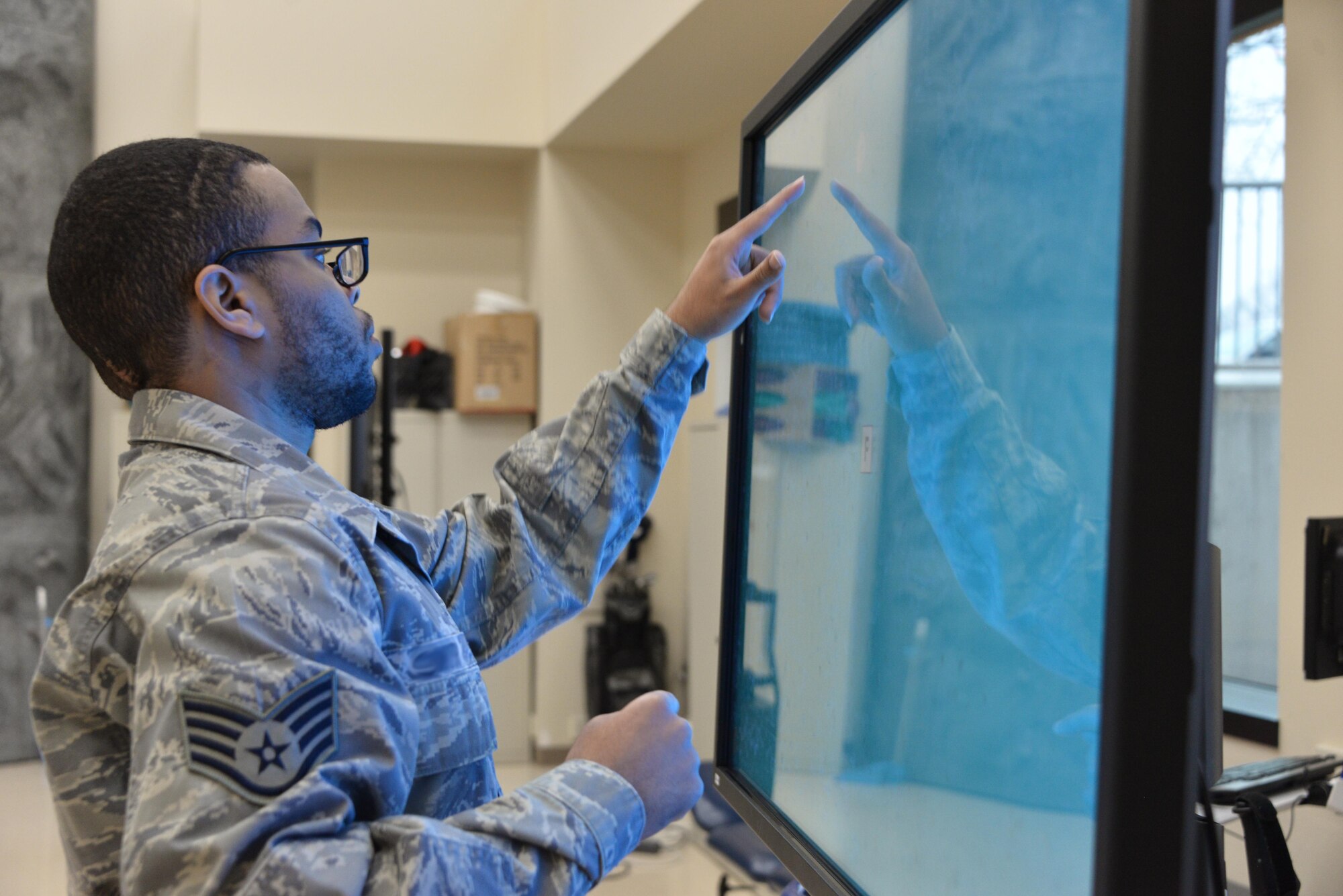 Staff Sgt. Rasheed, 7th Intelligence Squadron, selects a letter corresponding to a word spoken from a touch screen interactive program which tests his cognitive reaction time during occupational therapy Jan. 17. Rasheed suffered a cerebral aneurysm in 2015 and part of his recovery is working on occupational exercises. (U.S. Air Force photo/Staff Sgt. Alexandre Montes)
