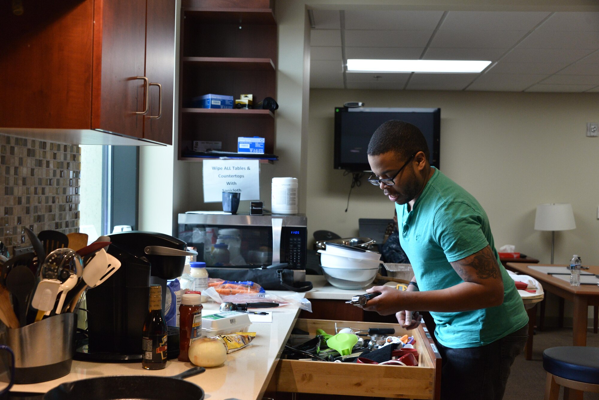 Staff Sgt. Rasheed, 7th Intelligence Squadron, consolidates a list of tool used during his cooking class as part of his occupational therapy sessions Jan. 17. Rasheed suffered a cerebral aneurysm in 2015. (U.S. Air Force photo/Staff Sgt. Alexandre Montes)
