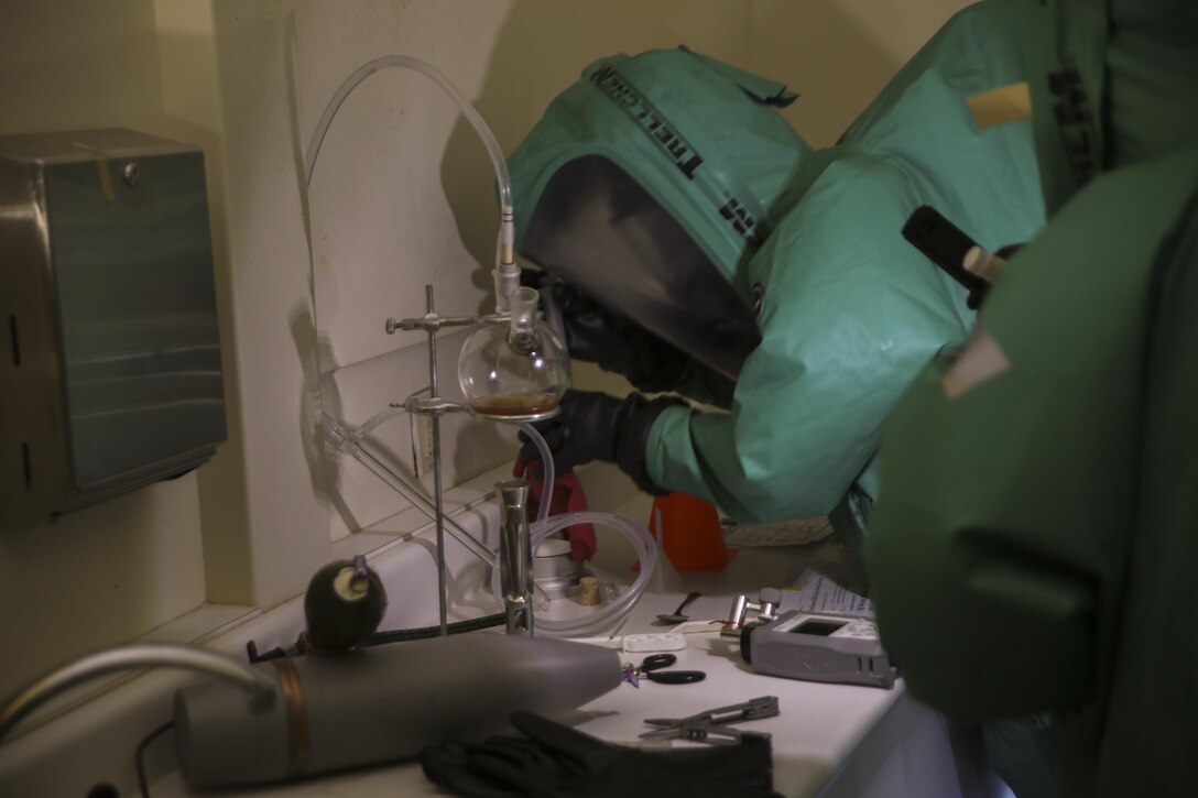 Lance Cpl. Thomas Ratterman, chemical, biological, radiological and nuclear defense specialist with Combat Logistics Regiment 45, 4th Marine Logistics Group, Marine Forces Reserve collect samples of an unknown chemical substance during the assessment and consequence management team training exercise at Marine Corps Support Facility, New Orleans, Feb. 8, 2017. During the exercise, Marines practiced responding to a chemical threat. The Marines conducted area reconnaissance, sample collection and classification of unknown substances. (United States Marine Corps photo by Sgt. Ian Ferro/Published)