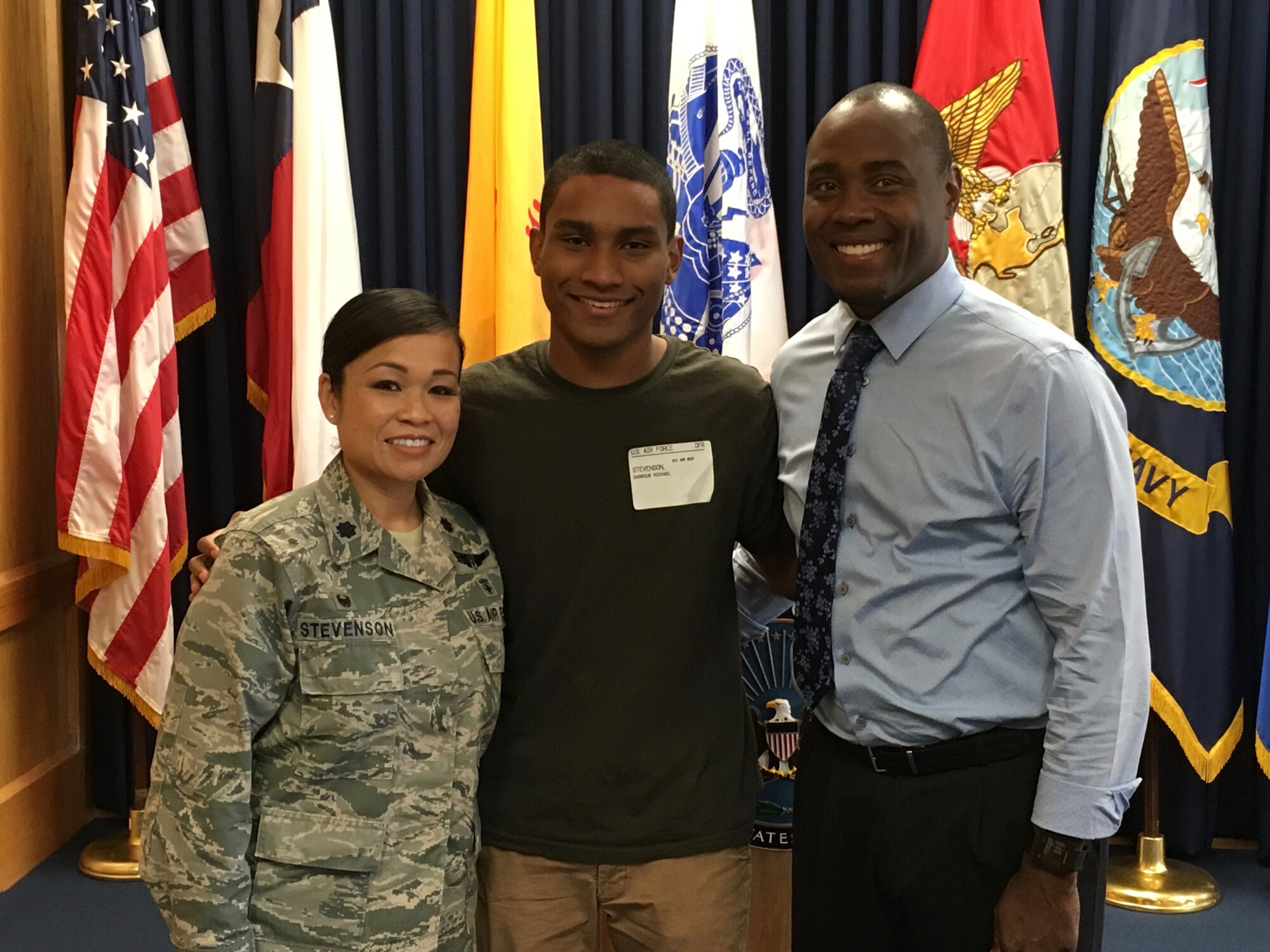 Lt. Col. Bonnie Stevenson, 49th Medical Operations Squadron commander, poses with her son, Airman Darrius Stevenson and her husband, Mr. Darrell Stevenson, as Darrius took the oath of enlistment at the Military Entrance Processing Station on 18 Oct. 2016, in El Paso, Texas. Airman Stevenson graduated from Air Force Basic Military Training at Lackland Air Force Base on Dec. 9, 2016. Airman Stevenson is currently receiving his Cyber Space Operation training at Keesler Air Force Base. (Photo courtesy of Lt. Col. Bonnie Stevenson)