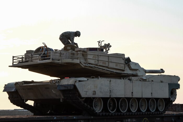 A tanker from 1st Battalion, 8th Infantry Regiment preps his vehicle for offload at Mihail Kogaliniceanu Airbase, Romania, Feb. 14, 2017. The arrival marks the start of back-to-back rotations of armored brigades in Europe as part of Atlantic Resolve. This rotation will enhance deterrence capabilities in the region, improve the U.S. ability to respond to potential crises and defend allies and partners in the European community. Army photo by Sgt. Devone Collins