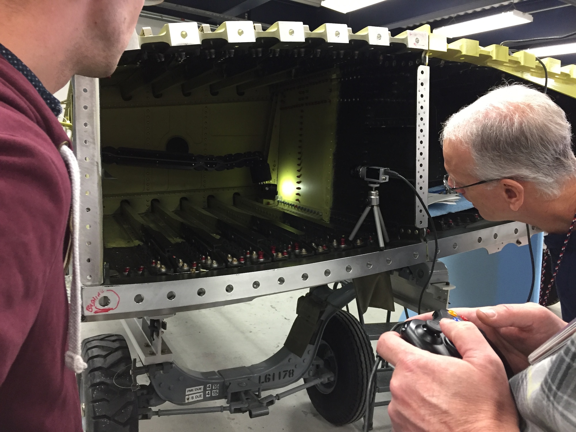 Jay Nielsen of the 809th Maintenance Support Squadron observes the snake arm motion of the Remote Access Nondestructive Evaluation tool during a recent demonstration at Hill Air Force Base Utah. (U.S. Air Force photo/Charles Buynak)