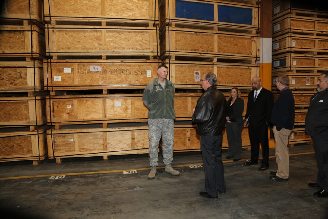 (Left) Lieutenant General Andrew E. Busch, U.S. Air Force, director, Defense Logistics Agency; talks with Brent Cox, Director, DLA Distribution, MCLBB; as Elizabeth Carroll, Environmental Protection Specialist Supervisor, DLA Disposition Services, MCLBB; Christopher Camacho, Area Manager, DLA Disposition Services, MCLBB and Kevin Lindsey, Operations Manager, DLA Distribution, MCLBB tour Warehouse 11 with Busch, Jan. 26