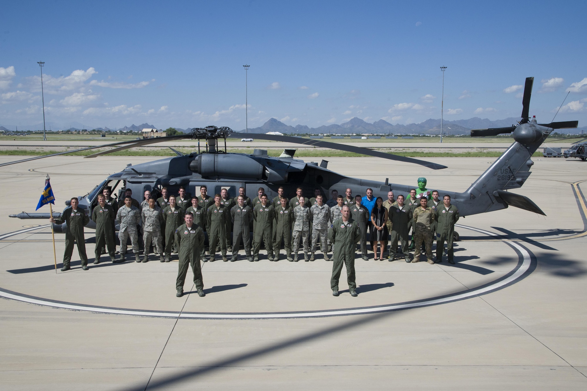 U.S. Airmen form the 55th Rescue Squadron pose for a group photo in front of an HH-60G Pave Hawk at Davis-Monthan Air Force Base, Ariz., Sept. 21, 2016.  The 55th RQS operates out of D-M but falls under the 23d Wing headquartered at Moody AFB, Ga. (U.S. Air Force photo by Senior Airman Betty R. Chevalier)