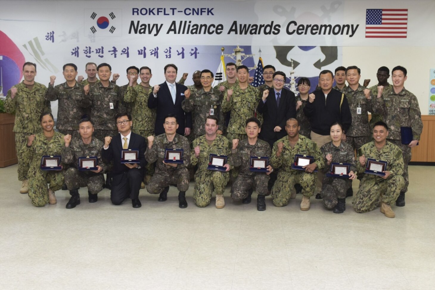 Vice Adm. Jung, Jin-Sup, the commander of Republic of Korea Fleet (CRF), Rear Adm. Brad Cooper, the commander of U.S. Naval Forces Korea (CNFK), and Marc Knapper, Chargé d’Affaires for the U.S. embassy in Seoul, stand with awardees from both navies during the second official CRF and CNFK Navy alliance awards ceremony, Feb. 16, 2017. The ceremony is in honor of CNFK's one-year anniversary since the command move to Busan. CNFK is the U.S. Navy's representative in the ROK, providing leadership and expertise in naval matters to improve institutional and operational effectiveness between the two navies and to strengthen collective security efforts in Korea and the region. 

