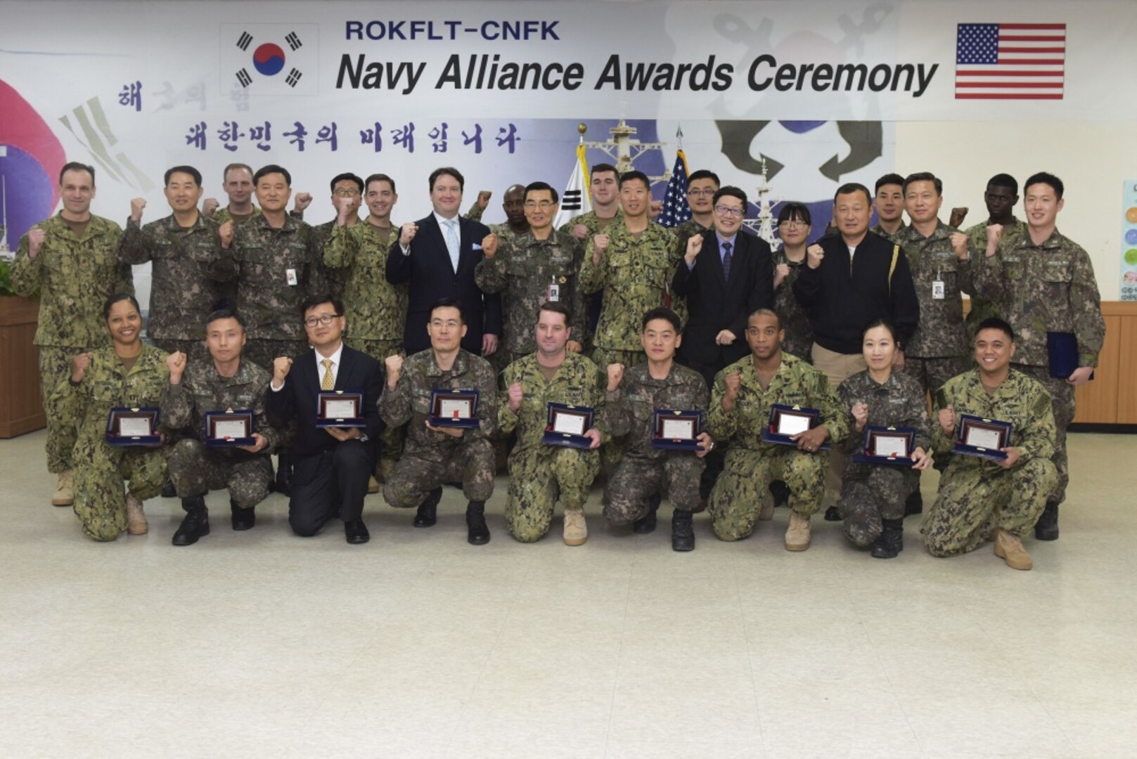 Vice Adm. Jung, Jin-Sup, the commander of Republic of Korea Fleet (CRF), Rear Adm. Brad Cooper, the commander of U.S. Naval Forces Korea (CNFK), and Marc Knapper, Chargé d’Affaires for the U.S. embassy in Seoul, stand with awardees from both navies during the second official CRF and CNFK Navy alliance awards ceremony, Feb. 16, 2017. The ceremony is in honor of CNFK's one-year anniversary since the command move to Busan. CNFK is the U.S. Navy's representative in the ROK, providing leadership and expertise in naval matters to improve institutional and operational effectiveness between the two navies and to strengthen collective security efforts in Korea and the region. 

