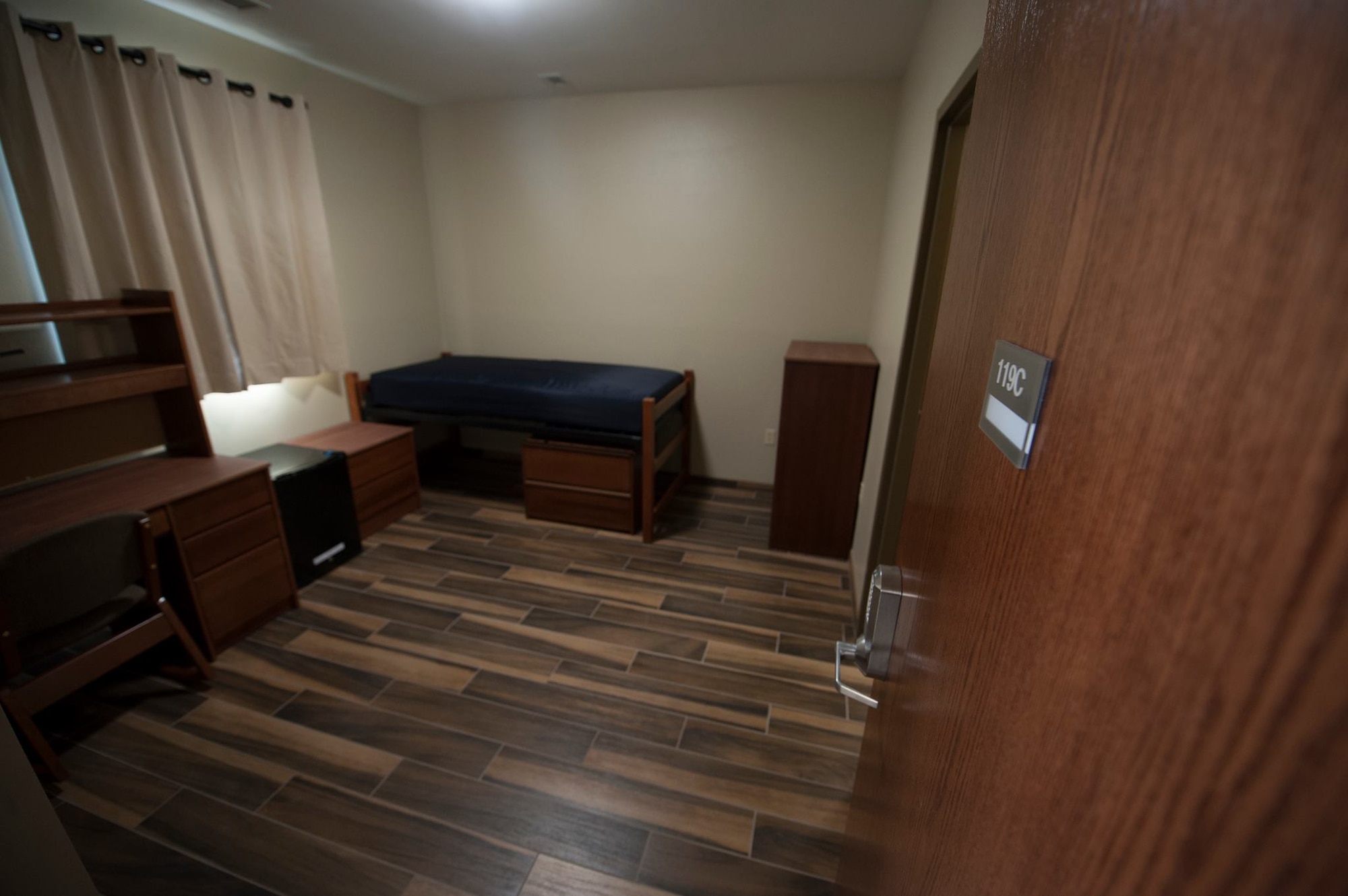 A dormitory room in the new facility on Nellis Air Force Base, Nev., is displayed after a ribbon cutting ceremony, Feb. 3, 2017. The 240-person facility has approximately 85,000 gross square feet with 60 four-bedroom/four-bathroom living unit modules. (U.S. Air Force photo by Airman 1st Class Kevin Tanenbaum/Released)