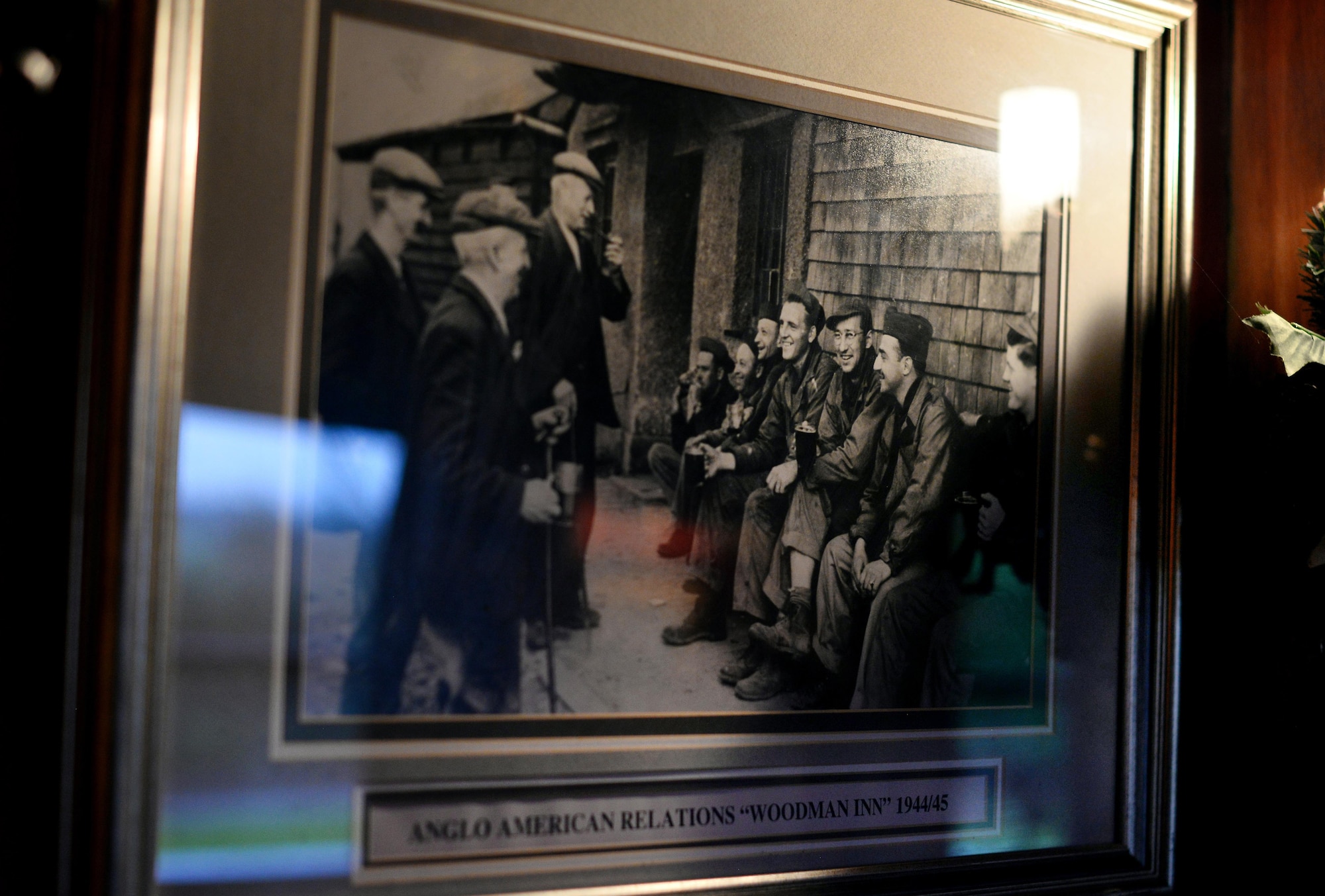 Photos depicting life during World War II adorn the walls of the Woodman Inn, located in Nuthampstead, England. Relationships between locals and American Airmen were often times forged in the Woodman Inn pub. (U.S. Air Force photo by Josh Plueger)