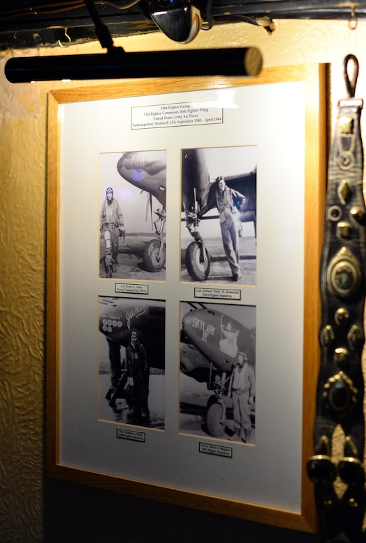 Photos of 55th Fighter Group pilots standing next to their P-38 Lightnings hang on the walls of the Woodman Inn, located in Nuthampstead, England. The décor of the Woodman solely pay tribute to the Airmen that flew the missions from the host air field. (U.S. Air Force photo by Josh Plueger)