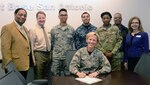Brig. Gen. Heather Pringle, commander, Joint Base San Antonio and 502nd Air Base Wing, signs a Military Saves Week proclamation Feb. 10, 2017 at JBSA-Fort Sam Houston. About 20 sessions have been chosen to educate Department of Defense cardholders on a variety of financial topics, from the new Blended Retirement System to credit management and are planned Feb. 27-March 3 throughout JBSA.

