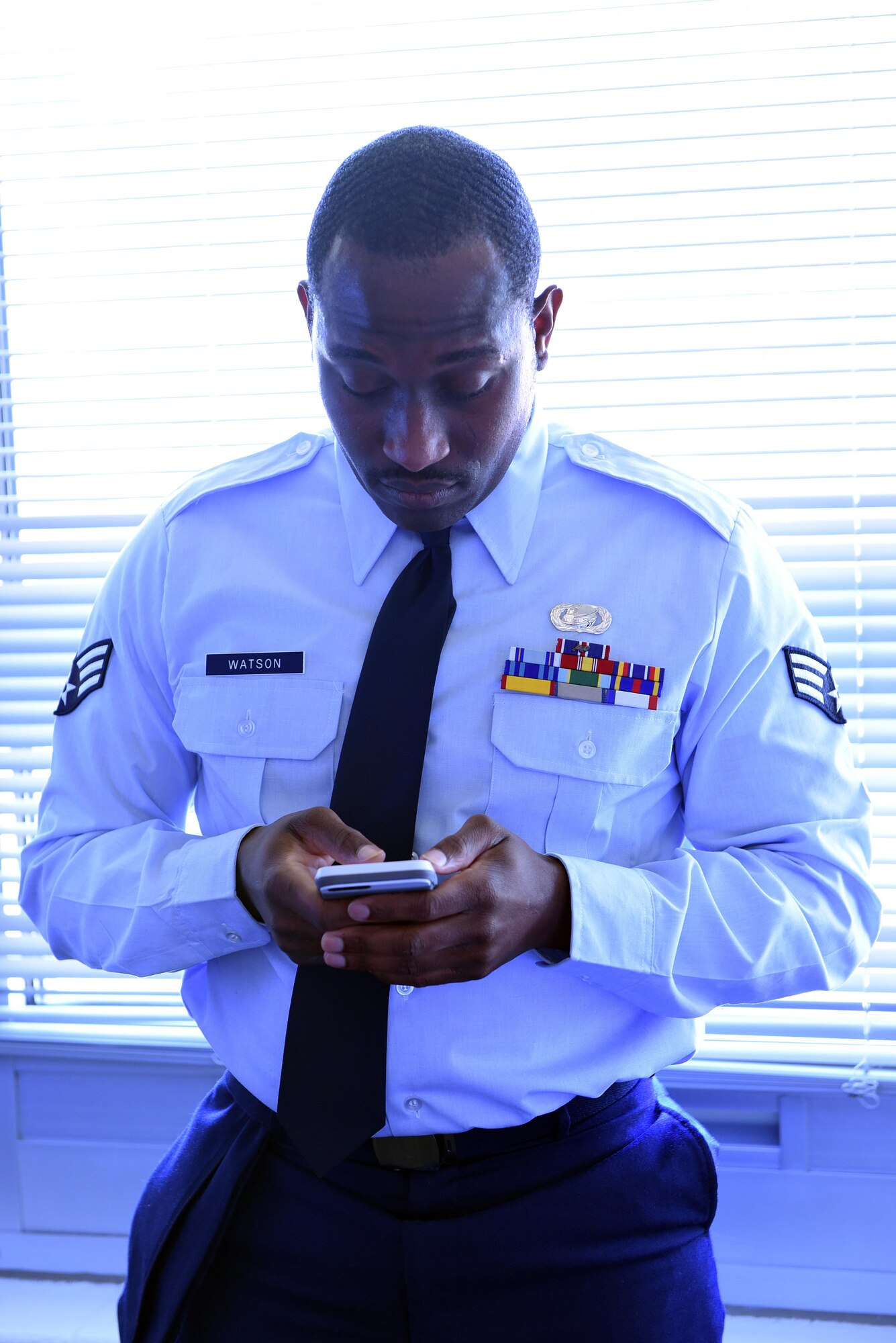 A Senior Airman checks his messages during Airman leadership school at the Chief Master Sergeant Paul H. Lankford Enlisted Professional Military Education Center in Tennessee. Instructors tell incoming students to clear their schedules from potential interruptions as well as secure support and time from family and friends during their studies. (U.S. Air National Guard photo by Master Sgt. Mike R. Smith)