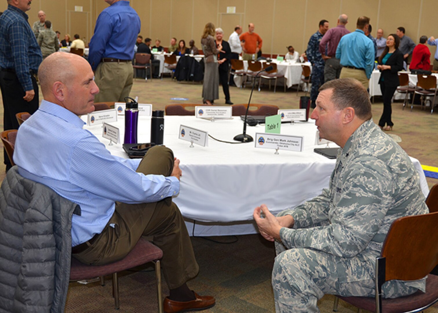 Former Defense Logistics Agency Aviation Commander Air Force Brig. Gen. (select) Mark Johnson, current commander of the Oklahoma City-Air Logistics Complex at Tinker Air Force Base, Oklahoma, and DLA Aviation's Deputy Commander Charlie Lilli have a discussion during a break at the annual Senior Leadership Conference, Feb. 7, 2017, on Defense Supply Center Richmond, Virginia. The conference was held from Feb. 7-9. Johnson spoke to DLA Aviation's leadership and strategic partners, from an Air Force customer’s perspective.