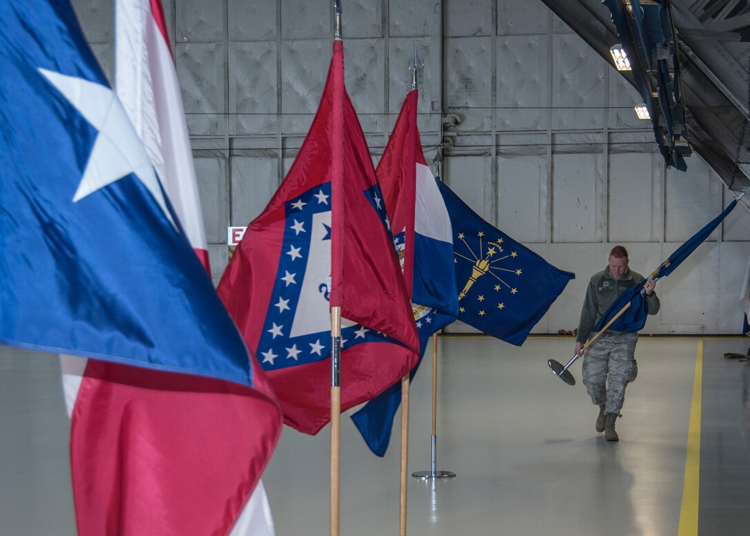 Senior Airman Matthew Beaton, 11th Civil Engineer Squadron engineering journeyman, arranges U.S. state flags in a hangar at Joint Base Andrews, Md., Feb. 16, 2017. Airmen like Beaton worked over the span of a morning, transforming a hangar into a decorated location for the Chief Master Sergeant of the Air Force Transition Ceremony, scheduled for Feb. 17. (U.S. Air Force photo by Senior Airmen Jordyn Fetter)
